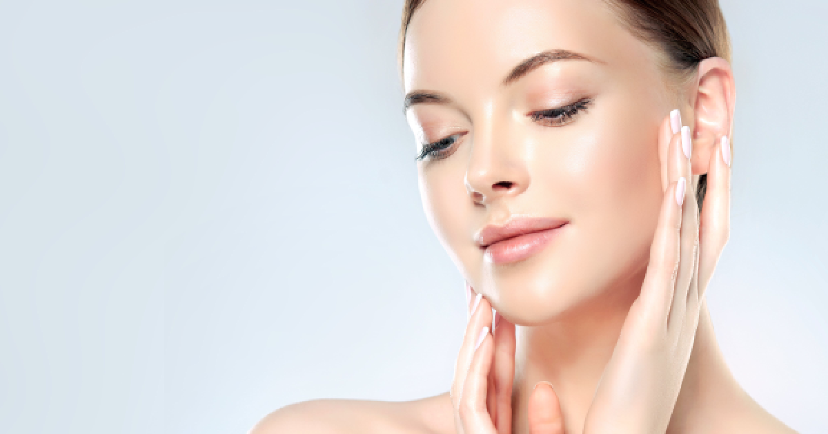 Woman with smooth, radiant skin gently touching her face, showcasing results from Morpheus8 in Philadelphia, PA